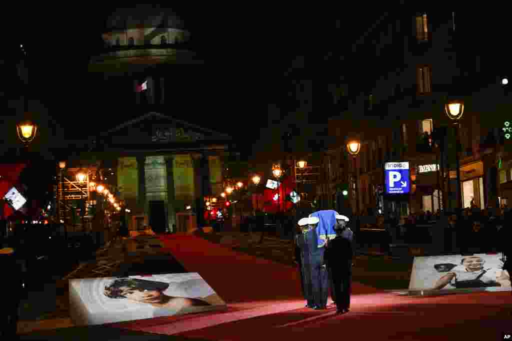The coffin of Josephine Baker, the American-born French dancer and singer who fought in the French Resistance and later battled racism, is carried towards the Pantheon monument in Paris, France, where Baker is to symbolically be inducted, becoming the first Black woman to receive France's highest honor. Her body will stay in Monaco at the request of her family.