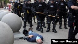 Martin Gugino lays on the ground after he was shoved by two Buffalo, New York, police officers during a protest against the death in Minneapolis police custody of George Floyd in Buffalo, New York