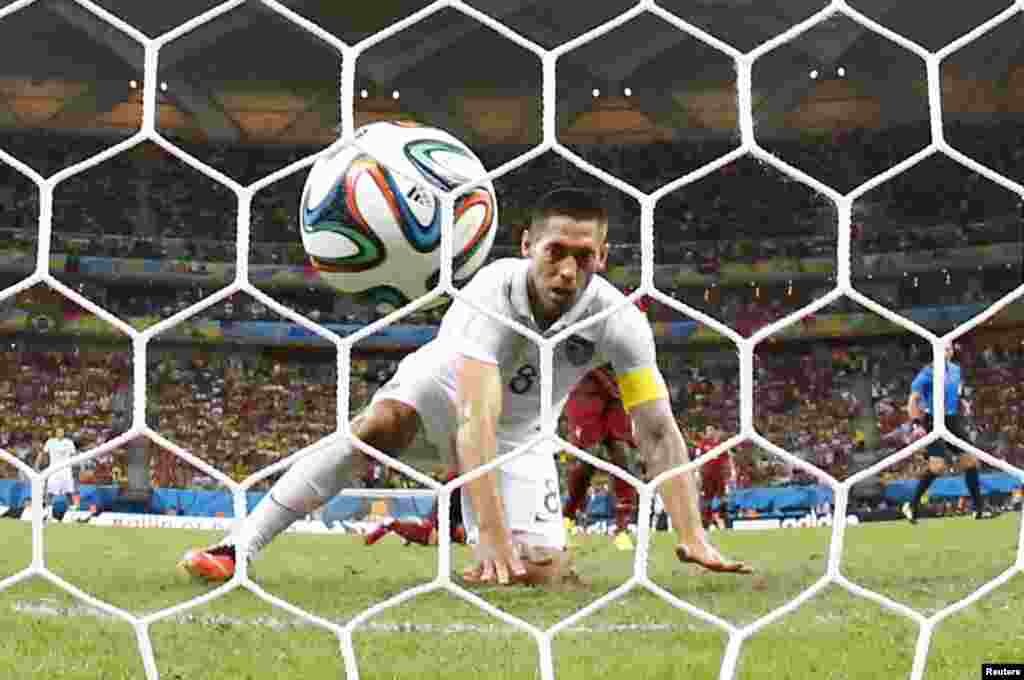 Clint Dempsey of the U.S. watches after knocking the ball into the net against Portugal at the Amazonia arena in Manaus, June 22, 2014. 