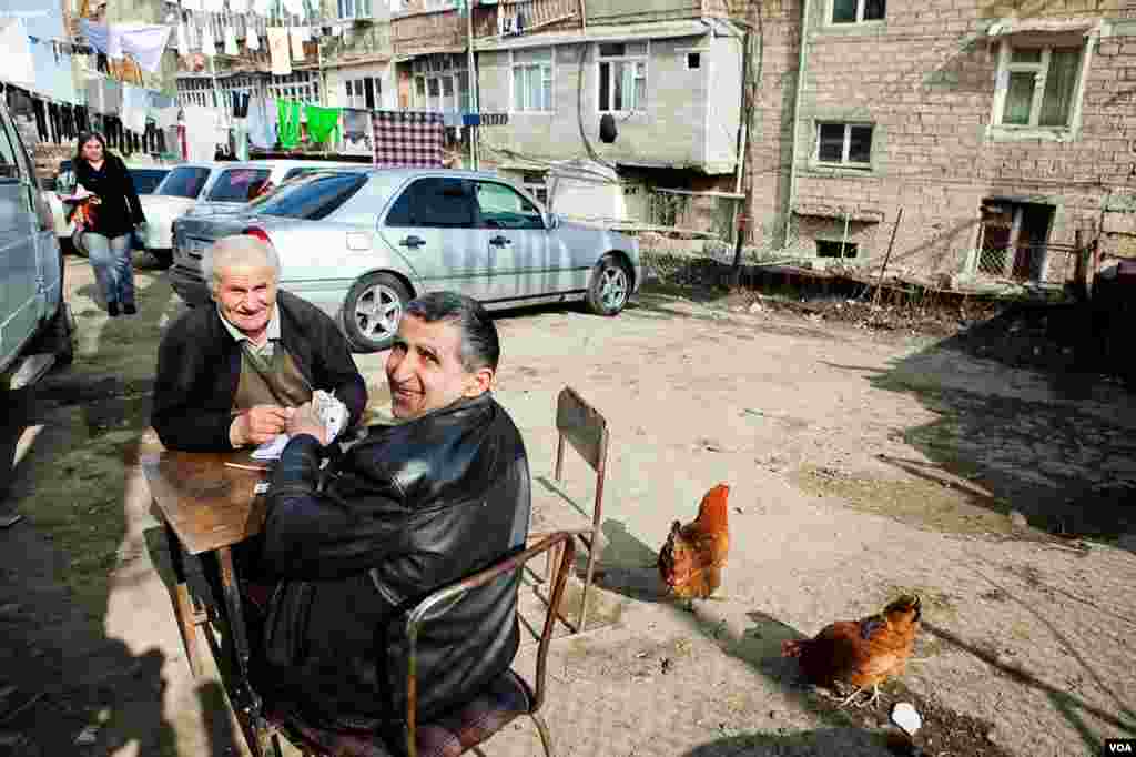 Men playing cards on a back street of sleepy Stepanakert. (U. Filimonova/VOA)