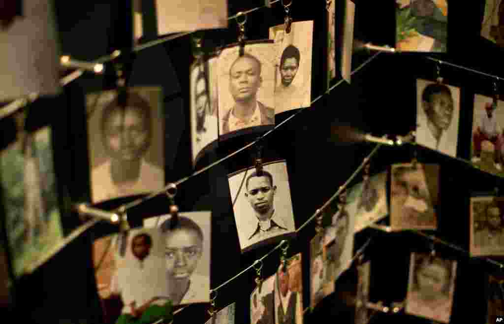 Family photographs of some of those who died hang in a display in the Kigali Genocide Memorial Centre in Kigali, April 5, 2014.