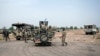 Des soldats de la 7ème division de l’armée nigériane sur un carrefour à Damboa, dans l’Etat de Borno, au nord-est du Nigeria, le 25 mars 2016.