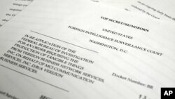 A photo made June 6, 2013 in Washington shows a copy of the U.S. Foreign Intelligence Surveillance Court order requiring Verizon on an "ongoing, daily basis" to give the National Security Administration (NSA) information on all landline and mobile teleph