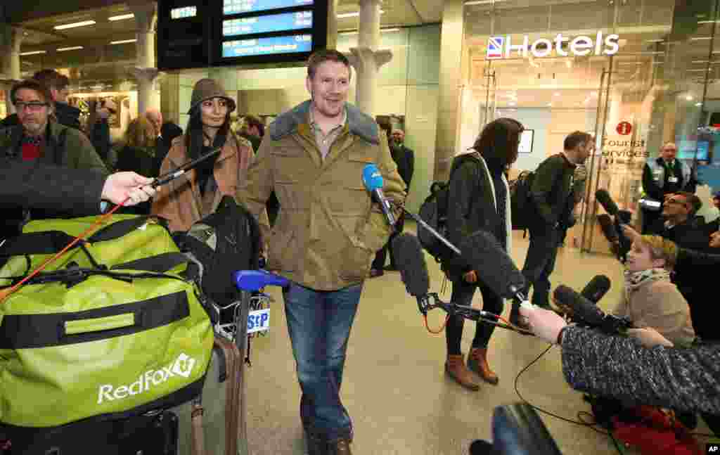 Anthony Perrett, an activist and one of the 30 Greenpeace crew arrested in the Russian Arctic, talks to the media after he arrives back in London, England, Dec. 27, 2013.