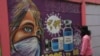 Mural bermuatan pesan kesadaran pandemi COVID-19 di Tangerang, 8 February 2021. (Photo by Demy Sanjaya / AFP)