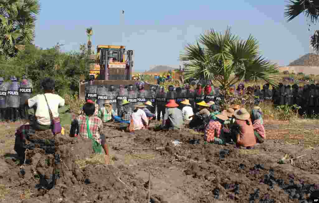 According to activists and opposition lawmakers, a woman was fatally shot Monday during a crackdown on protesters at the controversial Chinese-backed copper mine near Monywa in northwestern Myanmar, Dec. 22, 2014.