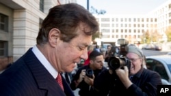 FILE - Paul Manafort, President Donald Trump's former campaign chairman, departs Federal District Court in Washington, Nov. 2, 2017. 