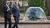 Russian Foreign Minister Sergey Lavrov, right, and U.S. Secretary of State John Kerry walk prior to their talks in the garden of the Foreign Ministry mansion in Moscow, Russia, May 7, 2013.