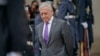 FILE - Defense Secretary Jim Mattis waits outside the Pentagon, Nov. 9, 2018. 
