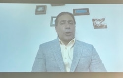 In this image from a video message on June 29, 2021, former Iranian political prisoner Mohammad Nikbakht addresses a human rights conference hosted by Washington's National Press Club on June 30, 2021. (Michael Lipin/VOA)