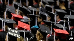 FILE - In this Aug. 6, 2011, picture, students attend graduation ceremonies at the University of Alabama in Tuscaloosa, Ala.