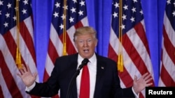  FILE - U.S. President-elect Donald Trump speaks during a news conference in the lobby of Trump Tower in New York, Jan. 11, 2017. 