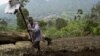 Muneman Rugema, 22, tills soil in Masisi, 88 km (55 miles) northwest of Goma, December 19, 2008.