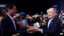 Democratic presidential candidate former New York City Mayor Mike Bloomberg shakes hands during a campaign rally, March 3, 2020, in West Palm Beach, Fla. 