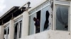 FILE PHOTO: A Somali police officer looks from the broken windows following an attack by al-Shabab militants at the Liido beach in Mogadishuu, Somalia, June 10, 2023.