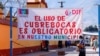 Un cartel en Tlacolula de Matamoros, Oaxaca, México, el 30 de enero de 2021, recuerda a la población la obligatoriedad de usar máscaras para evitar la propagación de COVID-19.