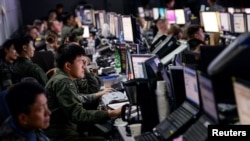 FILE - Members of the U.S. and Republic of Korea militaries man the Hardened Theater Air Control Center during the first day of Ulchi Freedom Guardian at Osan Air Base, South Korea, Aug. 17, 2015.