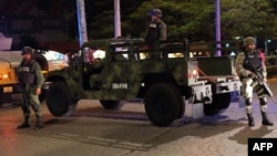 Mexican Army soldiers secure a local area after an armed confrontation between the Ministerial Police and criminal groups in the downtown area of Cancun, Quintana Roo State, Mexico. June 15, 2017.