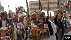 Supporters of Yemen's Houthi rebels attend a rally in Sanaa, April 26, 2018, against the killing of their political chief Saleh al-Sammad, in a Saudi-led air strike. Saudi Arabia media is reporting an airstrike on a Houthi meeting that killed two leaders and dozens of militiamen.