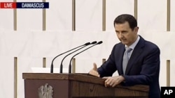 Presiden Suriah Bashar Assad berpidato di Damaskus, Minggu, 26 Juli 2015.