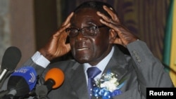 Zimbabwe's President Robert Mugabe speaks at the start of a conference of parties and civic society groups reviewing a draft constitution that, if adopted, will lead to Zimbabwe's next election, at a hotel in Harare, October 22, 2012.