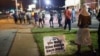  Demonstrators, marking the one-year anniversary of the shooting of Michael Brown, protest along West Florrisant Street on August 11, 2015 in Ferguson, Missouri. 