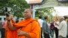 FILE - Luon Sovath, monk activist, is filming in front of Correctional Center 1 in the evening of 27th August, 2018 in Phnom Penh, Cambodia.