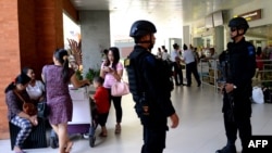 FILE - Indonesian Special Police patrol at Ngurah Rai Airport in Denpasar on Indonesia's resort island of Bali on Jan. 15, 2016.