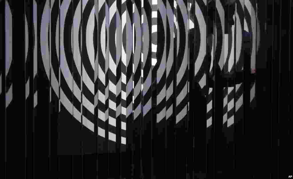 Artwork "Cloison a lames reflechissantes" created by Argentina artist Julio Le Parc at Art Basel in Hong Kong, March 25, 2016