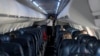 Para awak kabin di dalam kabin Delta Airlines yang nyaris kosong di tengah wabah virus corona, dalam penerbangan dari Salt Lake City, Utah, 11 April 2020.