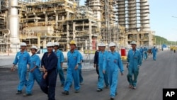 FILE - Dung Quat refinery is seen on Sunday, Feb. 22, 2009, in central Quang Ngai province, Vietnam. Vietnam opens its first oil refinery, a $3 billion project that will meet some of the nation's petroleum needs and ease its dependence on imported fuel. (AP Photo/Vietnam News Agency,Thanh Long )