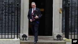 FILE - Britain's Prime Minister Keir Starmer leaves 10 Downing Street to attend the weekly Prime Minister's Questions session in Parliament, in London, Feb. 12, 2025.
