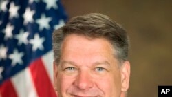 This photo provided by the Department of Justice shows Timothy Shea, currently senior counselor to Attorney General William Barr.