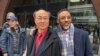 Massachusetts resident Litang Liang, left, and his lawyer, Derege Demissie, stand outside the federal court after a jury acquitted Liang of U.S. charges that he acted as an unregistered agent of China, in Boston, Feb. 10, 2025. 