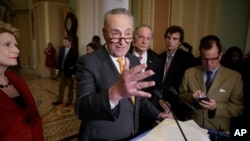 FILE - Senate Minority Leader Charles Schumer of N.Y., speaks with reporters following a closed-door strategy session, March 28, 2017, on Capitol Hill in Washington.