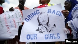 People take part in a protest demanding the release of abducted secondary school girls from the remote village of Chibok, in Lagos, May 5, 2014.