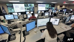 FILE - The National Cybersecurity & Communications Integration Center (NCCIC) prepares for the Cyber Storm III exercise at its operations center in Arlington, Virginia, Sept. 2010.