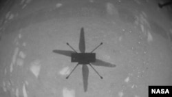 NASA’s Ingenuity Mars Helicopter captured this shot as it hovered over the Martian surface on Apr. 19, 2021, during the first instance of powered, controlled flight on another planet. (NASA/JPL-Caltech)