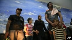 Officials said they rescued 60 asylum seekers after their boat broke down while trying to reach Australia, July 29, 2012.