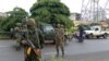 Army soldiers hold a checkpoint after the uprising that led to the toppling of President Alpha Conde in Kaloum neighbourhood of Conacry in Guinea, Sept. 6, 2021.