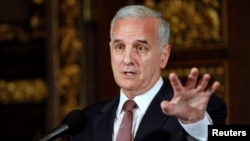 FILE - Minnesota Gov. Mark Dayton speaks to media in St. Paul, Minnesota, July 20, 2011.
