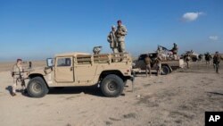 Unidades del ejército iraquí son emplazadas durante operaciones militares de la Séptima Brigada del ejército de Irak en la provincia de Anbar. Dic. 29 de 2019. AP/Nasser Nasser.