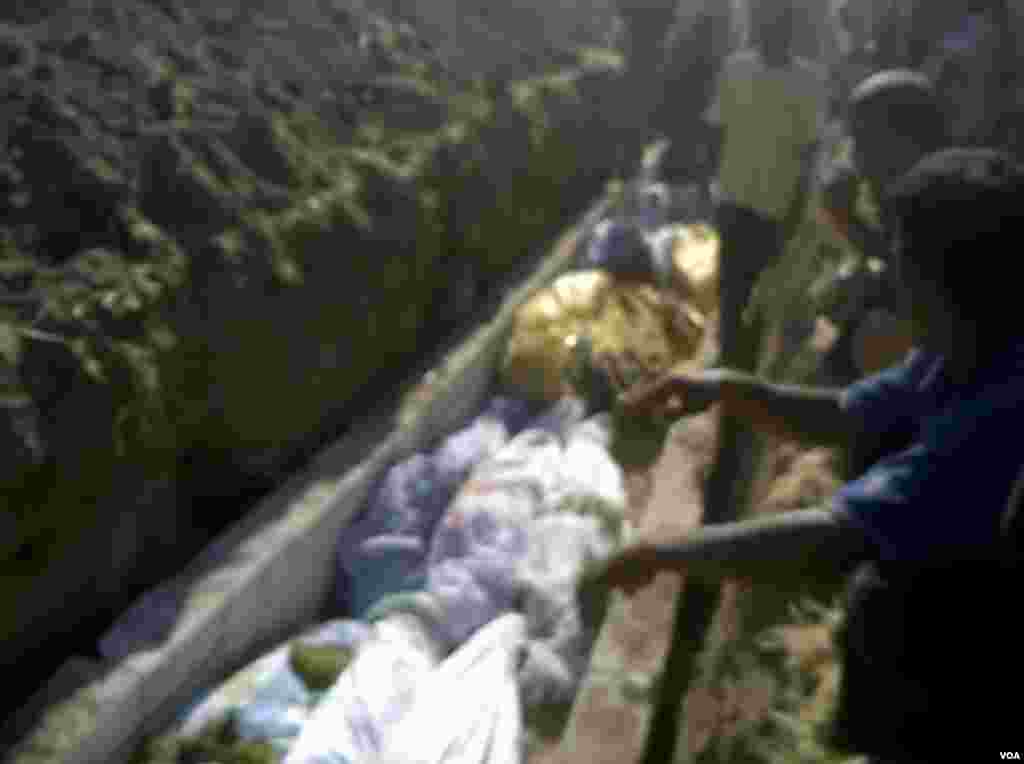 This image made from amateur video from Hama Revolution 2011 purports to show a funeral for victims killed in Tremseh, Syria, July 13, 2012. (AP/ Hama Revolution 2011)