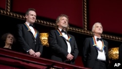 FILE - Rock band Led Zeppelin, from left, keyboardist/bassist John Paul Jones, singer Robert Plant, guitarist Jimmy Page, at the Kennedy Center Honors Gala, Washington, December 2, 2012. 