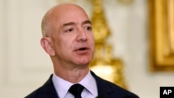 FILE - Jeff Bezos, the founder and CEO of Amazon.com, speaks in the State Dining Room of the White House in Washington, May 5, 2016. 
