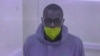 FILE - This video grab from an AFPTV video taken on Jan. 21, 2022 in Kampala shows Kakwenza Rukirabashaija appearing in court via a video link from prison on charges of 'offensive communication.' 