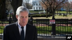 Special Counsel Robert Mueller walks past the White House after attending services at St. John's Episcopal Church, in Washington, Sunday, March 24, 2019.