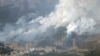 FILE - An aerial views shows a forest fire on a mountain in Ofunato, Iwate Prefecture, northeastern Japan, February 28, 2025, in this photo taken by Kyodo. (Kyodo/via Reuters) 