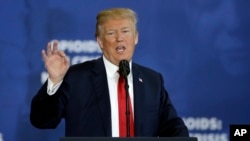 FILE - President Donald Trump speaks about his plan to combat opioid drug addiction at Manchester Community College, March 19, 2018, in Manchester, New Hampshire.
