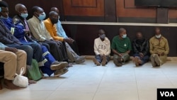Some of the arrested Zimbabwe independence war veterans are seen at Harare Magistrates Court, in Harare, Oct. 29, 2021. (Columbus Mavhunga/VOA)